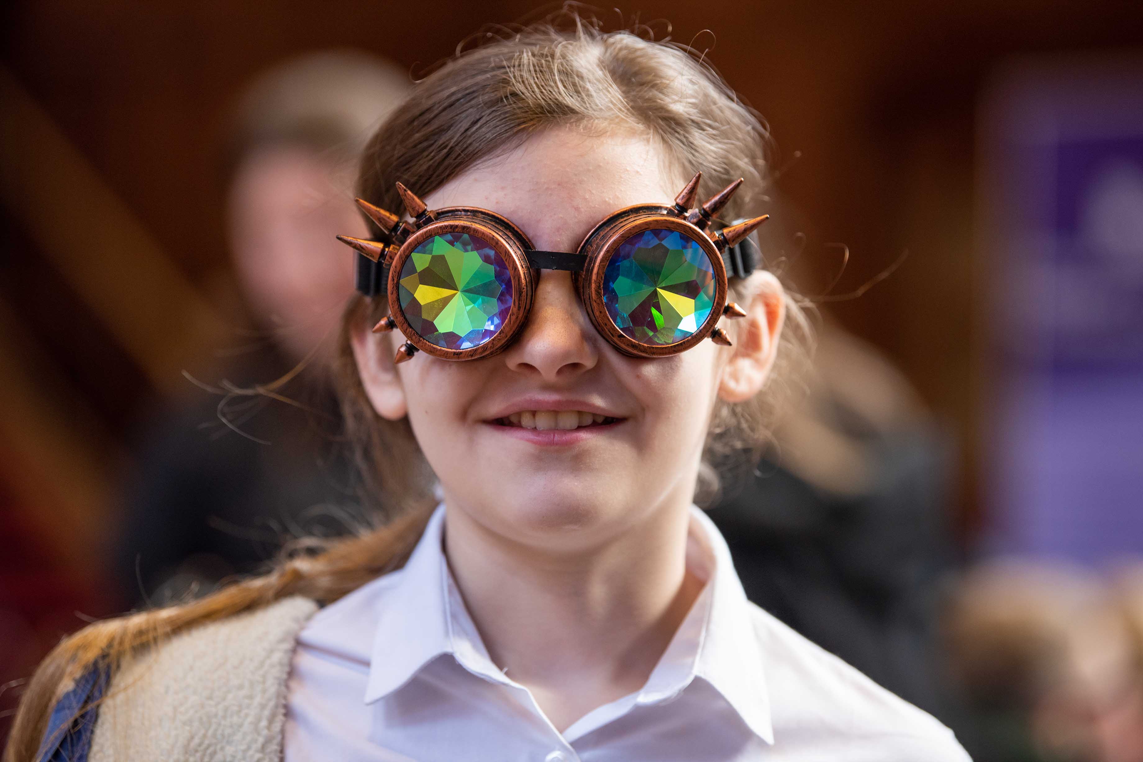 Pupil wearing spectacles that make you see from a bug's point of view
